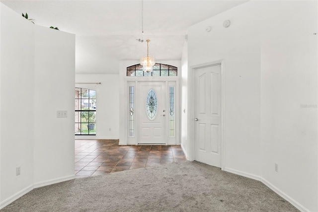 2790 Pelham Cir, Deltona, FL 32738 - carpeted foyer featuring a chandelier and tile patterned floors