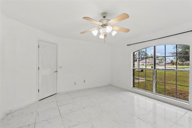 2790 Pelham Cir, Deltona, FL 32738 - spare room with light marble finish floors and a ceiling fan