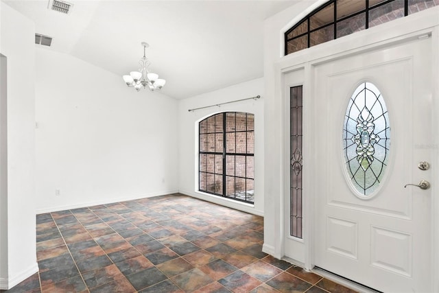 2790 Pelham Cir, Deltona, FL 32738 - entrance foyer featuring a chandelier, stone finish floors, and vaulted ceiling