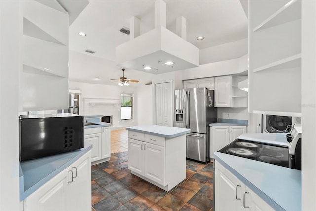 2790 Pelham Cir, Deltona, FL 32738 - kitchen with stainless steel fridge with ice dispenser, open shelves, ceiling fan, a center island, and dark stone finish floors