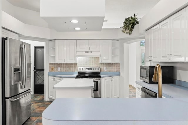 2790 Pelham Cir, Deltona, FL 32738 - kitchen with appliances with stainless steel finishes, open shelves, premium range hood, light countertops, and recessed lighting