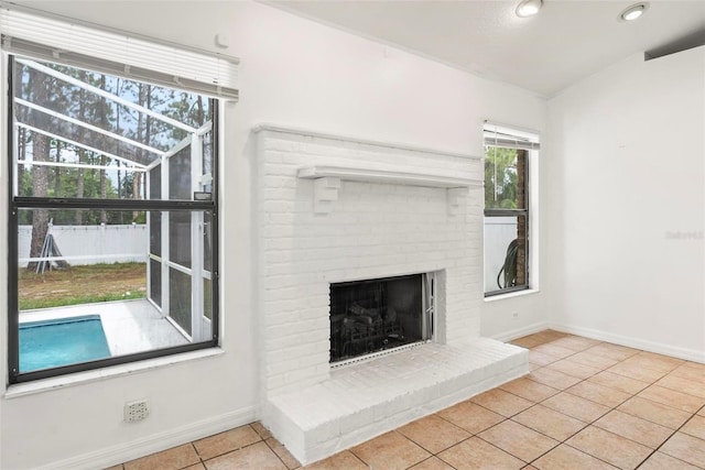2790 Pelham Cir, Deltona, FL 32738 - unfurnished living room featuring tile patterned flooring and a fireplace