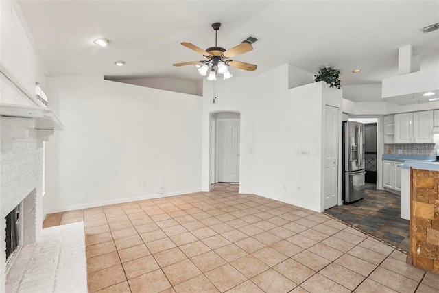 2790 Pelham Cir, Deltona, FL 32738 - unfurnished living room featuring a ceiling fan, arched walkways, a fireplace, lofted ceiling, and recessed lighting