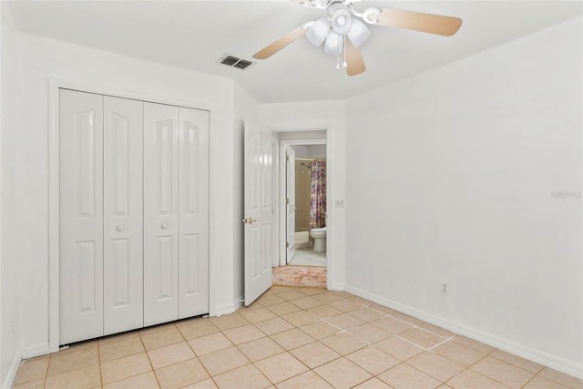 2790 Pelham Cir, Deltona, FL 32738 - unfurnished bedroom featuring a closet, light tile patterned flooring, and a ceiling fan
