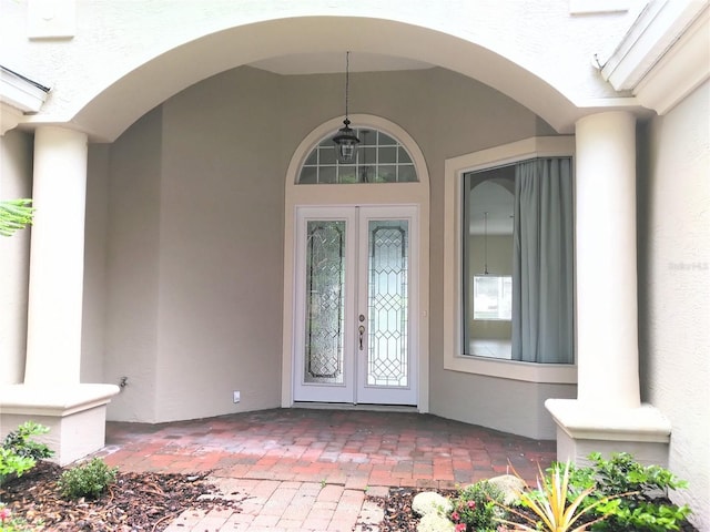 28 Front St, Palm Coast, FL 32137 - doorway to property with french doors and stucco siding