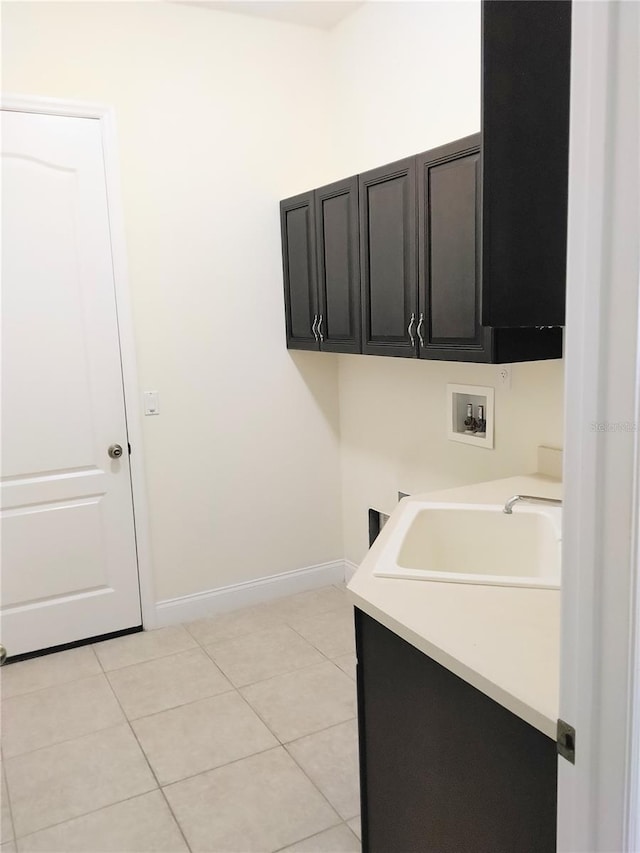 28 Front St, Palm Coast, FL 32137 - laundry area featuring cabinet space, hookup for a washing machine, and light tile patterned floors