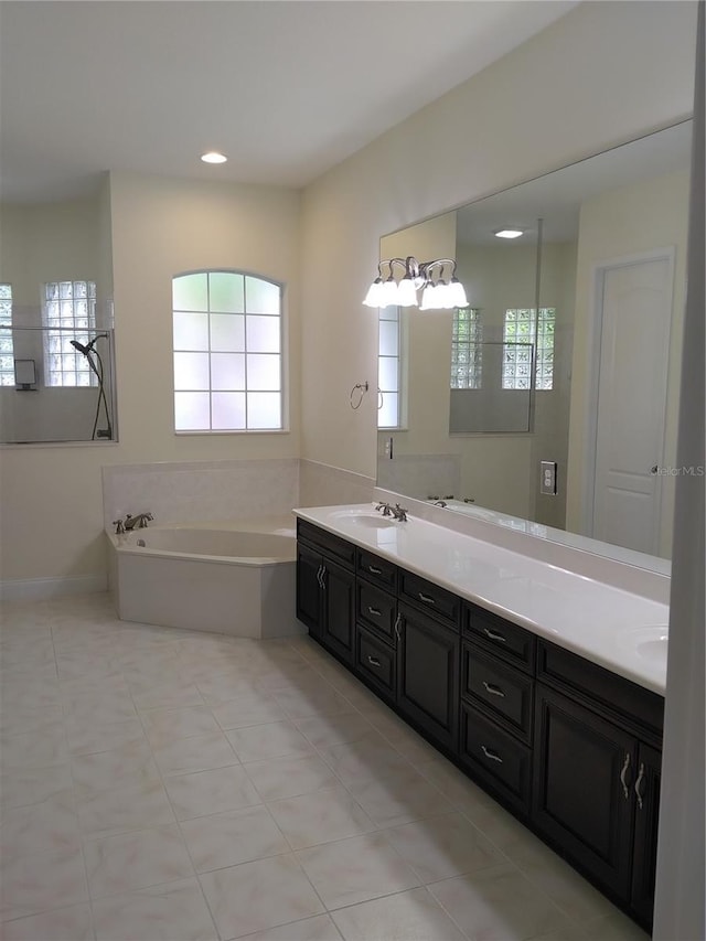28 Front St, Palm Coast, FL 32137 - bathroom featuring plenty of natural light, double vanity, and recessed lighting