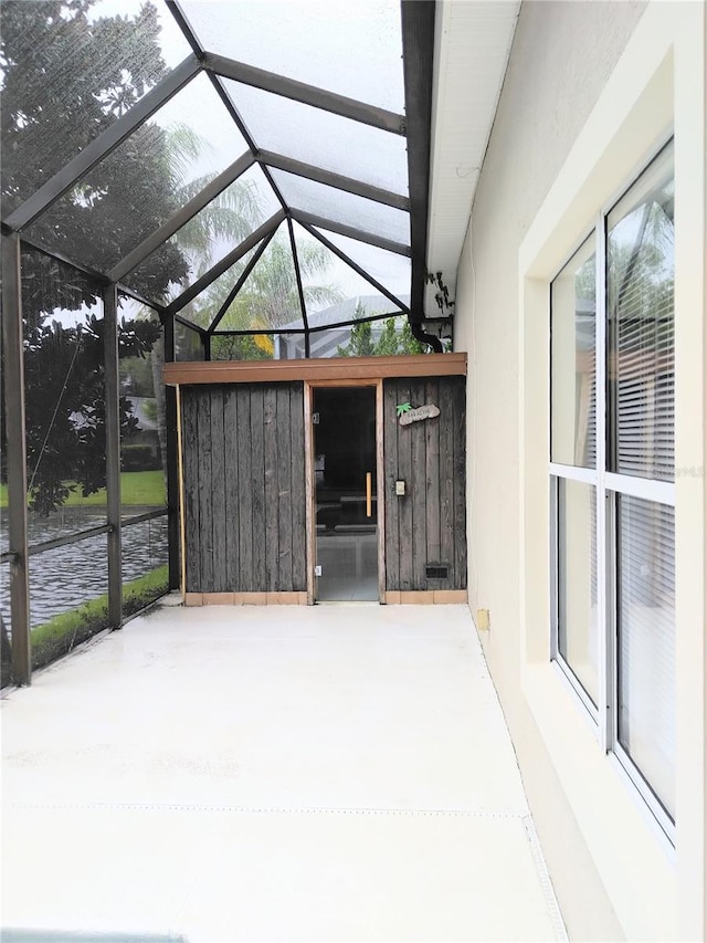 28 Front St, Palm Coast, FL 32137 - unfurnished sunroom with lofted ceiling and healthy amount of natural light
