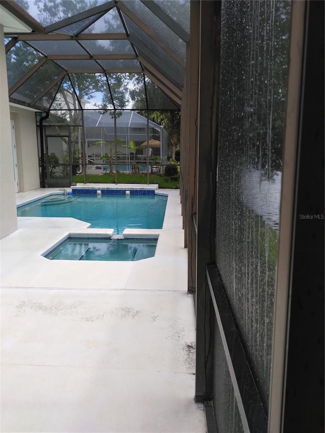 28 Front St, Palm Coast, FL 32137 - view of pool featuring a pool with connected hot tub and a patio area