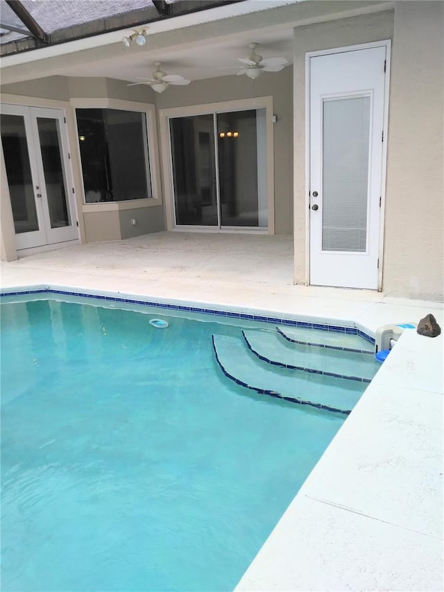 28 Front St, Palm Coast, FL 32137 - outdoor pool featuring a ceiling fan, a patio area, and french doors
