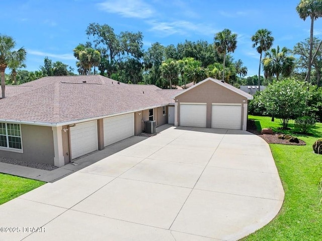 3959 S Chinook Ln, Ormond Beach, FL 32174 - ranch-style home featuring a garage, stucco siding, a front yard, roof with shingles, and concrete driveway