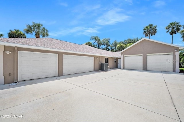 3959 S Chinook Ln, Ormond Beach, FL 32174 - view of front of home with stucco siding, an attached garage, and concrete driveway