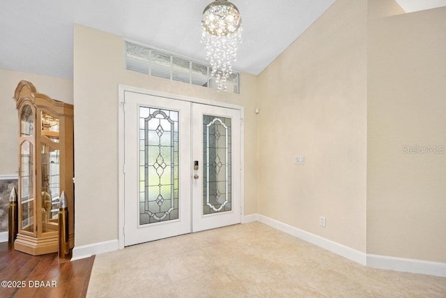 3959 S Chinook Ln, Ormond Beach, FL 32174 - foyer entrance featuring french doors and a chandelier