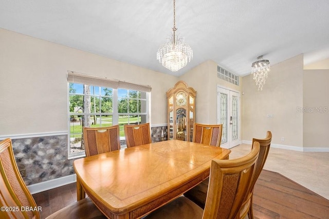 3959 S Chinook Ln, Ormond Beach, FL 32174 - dining room featuring a chandelier, french doors, and wood finished floors