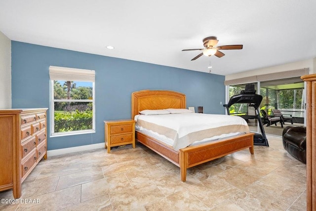 3959 S Chinook Ln, Ormond Beach, FL 32174 - bedroom featuring multiple windows, light stone finish flooring, and a ceiling fan