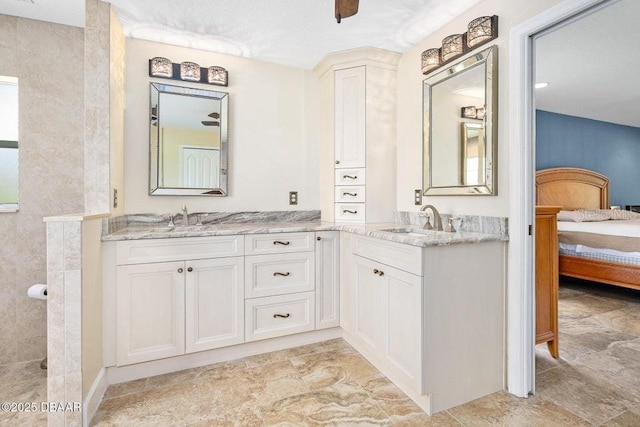 3959 S Chinook Ln, Ormond Beach, FL 32174 - bathroom featuring ensuite bathroom, two vanities, and a walk in shower