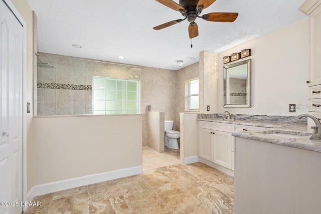3959 S Chinook Ln, Ormond Beach, FL 32174 - bathroom with a walk in shower, vanity, ceiling fan, and recessed lighting