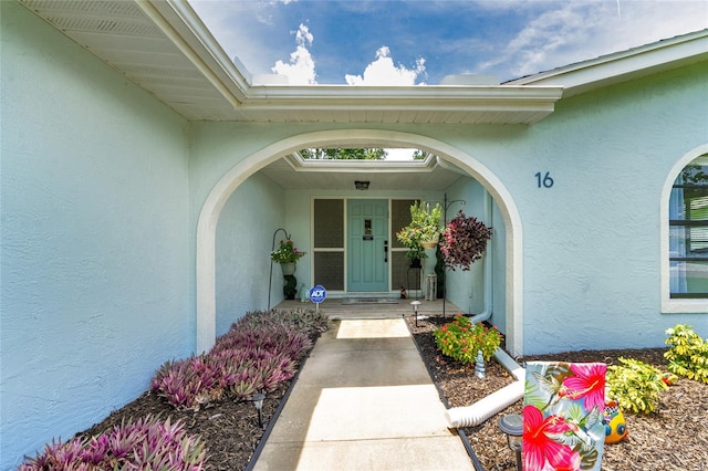 16 Courtney Pl, Palm Coast, FL 32137 - doorway to property with stucco siding