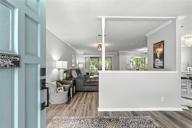 16 Courtney Pl, Palm Coast, FL 32137 - living area with ornamental molding, wood finished floors, and a textured ceiling