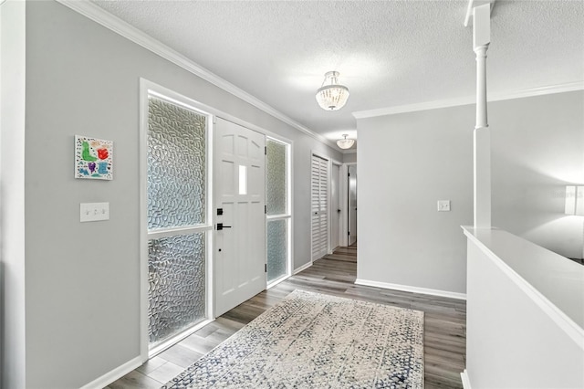 16 Courtney Pl, Palm Coast, FL 32137 - entrance foyer with ornamental molding, wood finished floors, and a textured ceiling
