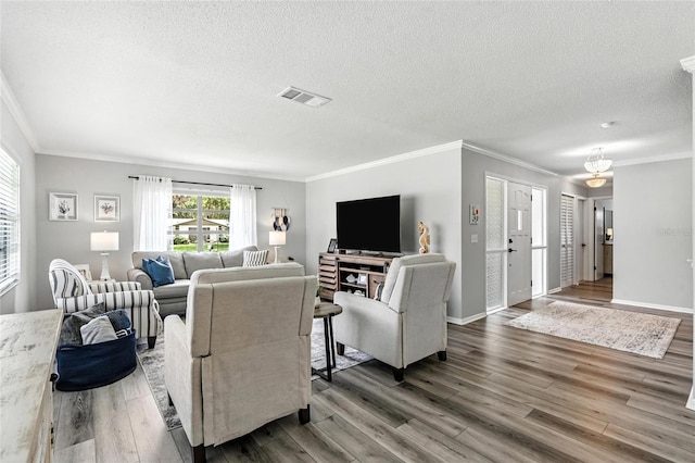 16 Courtney Pl, Palm Coast, FL 32137 - living room with ornamental molding, wood finished floors, and a textured ceiling