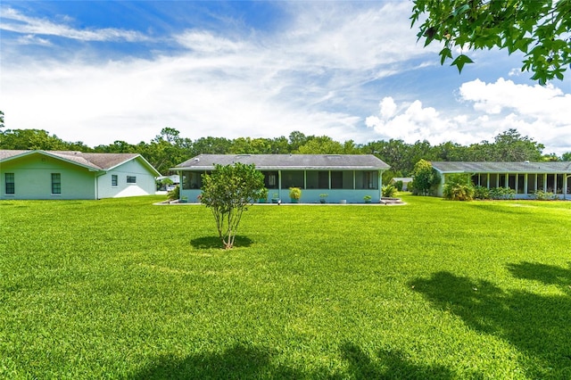 16 Courtney Pl, Palm Coast, FL 32137 - back of house with a sunroom and a yard