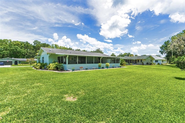 16 Courtney Pl, Palm Coast, FL 32137 - rear view of house featuring a sunroom, a yard, and stucco siding