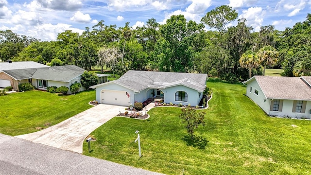 16 Courtney Pl, Palm Coast, FL 32137 - view of front facade featuring a garage, driveway, a front yard, and stucco siding