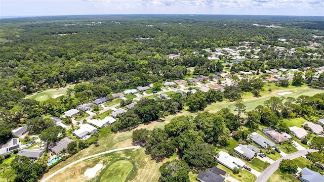 16 Courtney Pl, Palm Coast, FL 32137 - aerial view of property and surrounding area featuring a golf course and nearby suburban area