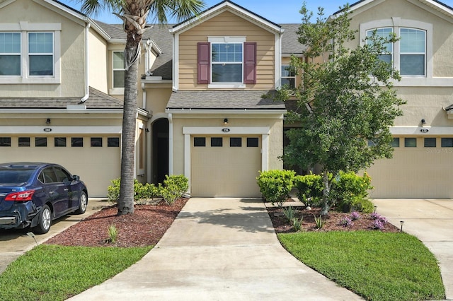 176 Nelson Ln, Saint Johns, FL 32259 - view of front facade with roof with shingles, a garage, stucco siding, and concrete driveway