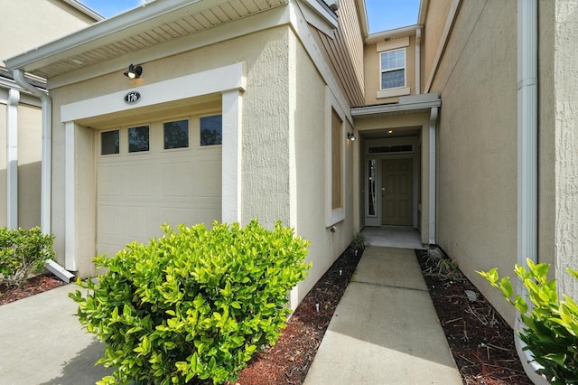 176 Nelson Ln, Saint Johns, FL 32259 - property entrance with stucco siding and a garage