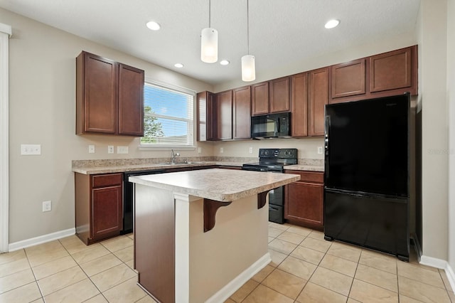 176 Nelson Ln, Saint Johns, FL 32259 - kitchen featuring black appliances, light countertops, hanging light fixtures, a center island, and light tile patterned floors