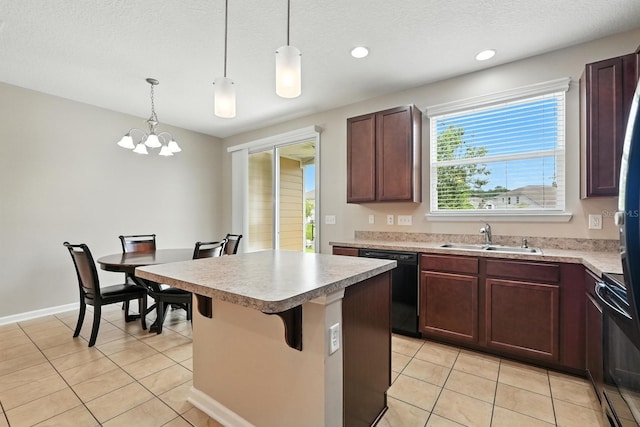 176 Nelson Ln, Saint Johns, FL 32259 - kitchen with black appliances, light tile patterned floors, a center island, light countertops, and recessed lighting