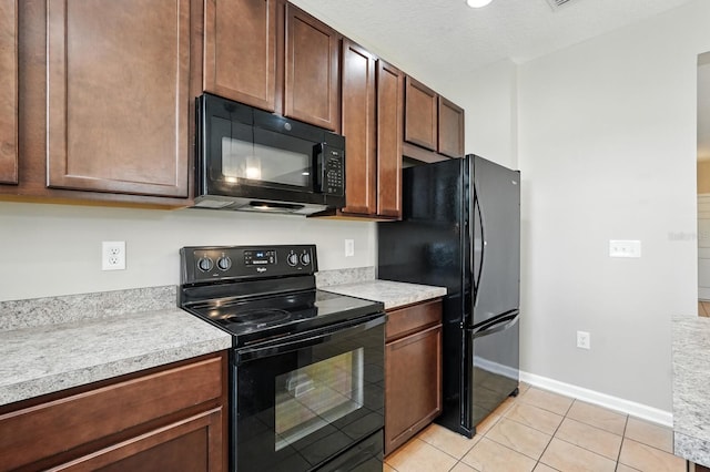 176 Nelson Ln, Saint Johns, FL 32259 - kitchen with black appliances, light countertops, and light tile patterned floors