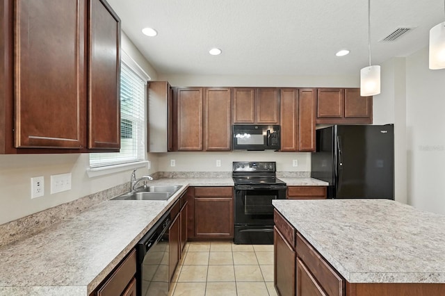 176 Nelson Ln, Saint Johns, FL 32259 - kitchen with black appliances, light tile patterned flooring, pendant lighting, light countertops, and recessed lighting