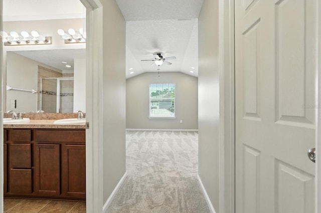 176 Nelson Ln, Saint Johns, FL 32259 - bathroom with ceiling fan, a stall shower, lofted ceiling, and double vanity
