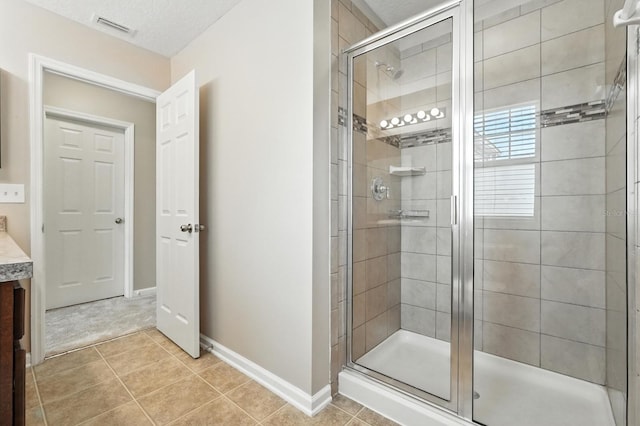 176 Nelson Ln, Saint Johns, FL 32259 - bathroom featuring a stall shower, tile patterned flooring, and vanity