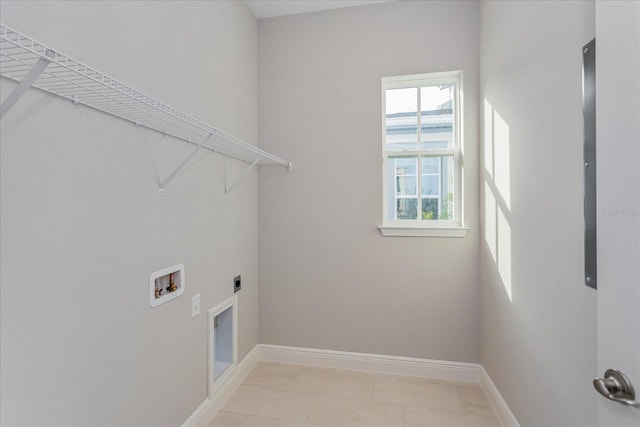 washroom featuring baseboards, laundry area, hookup for a washing machine, and hookup for an electric dryer