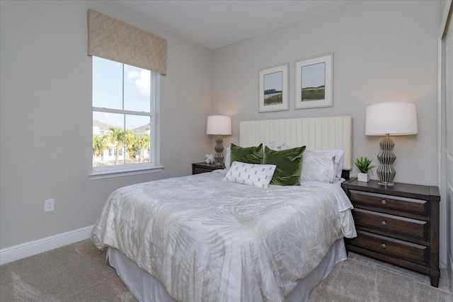 bedroom featuring light carpet