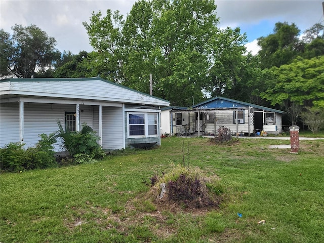 view of yard with covered porch