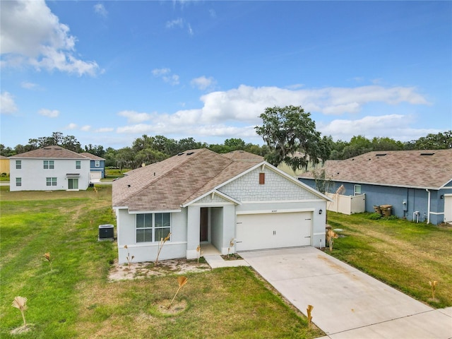 ranch-style home featuring a front lawn and a garage