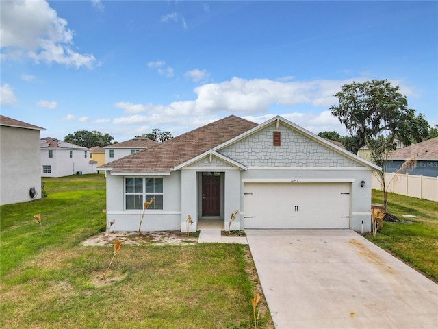 view of front of house featuring a front yard and a garage