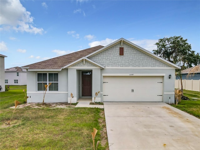 view of front of property with a front lawn and a garage