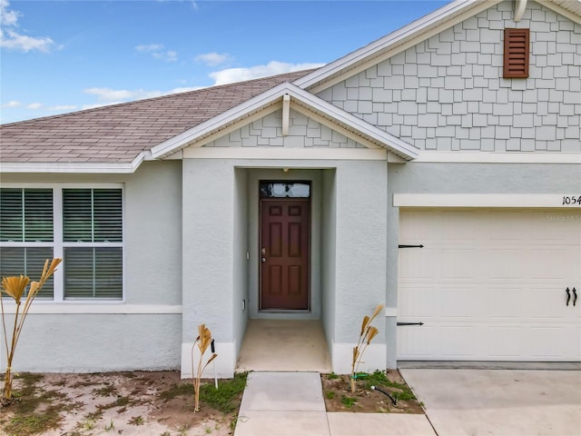 view of exterior entry featuring a garage