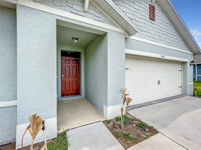 doorway to property featuring a garage