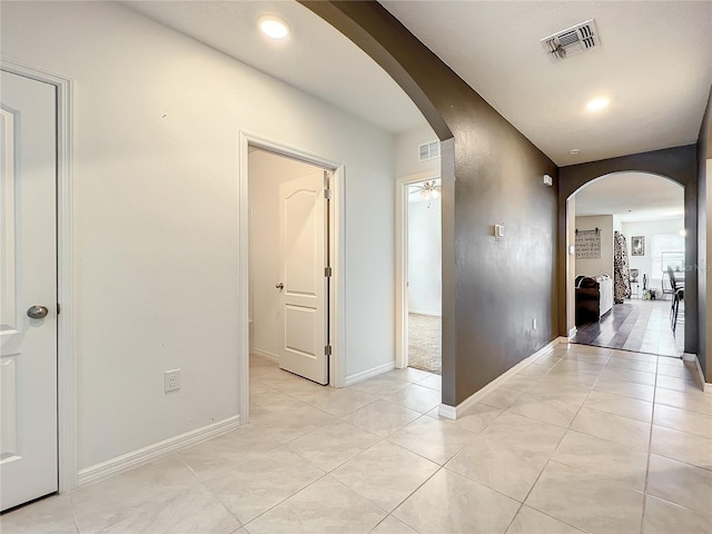 hall with light tile flooring