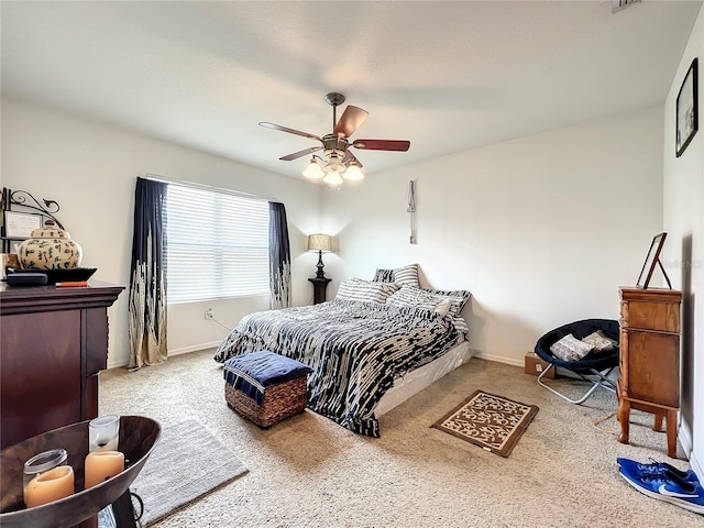 bedroom with light carpet and ceiling fan