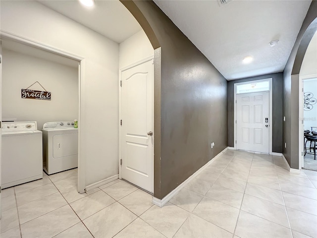 interior space with light tile flooring and separate washer and dryer