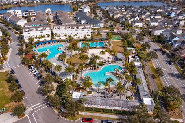 aerial view featuring a residential view and a water view