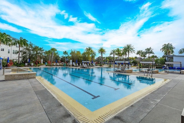 community pool with a patio area